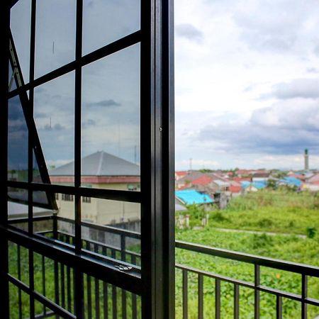 Oyo 90162 Remboelan Guest House Sungai Lutus Kültér fotó